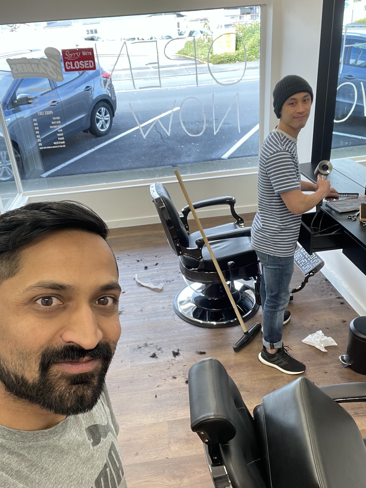 Candid customer photo inside the shop after a cut